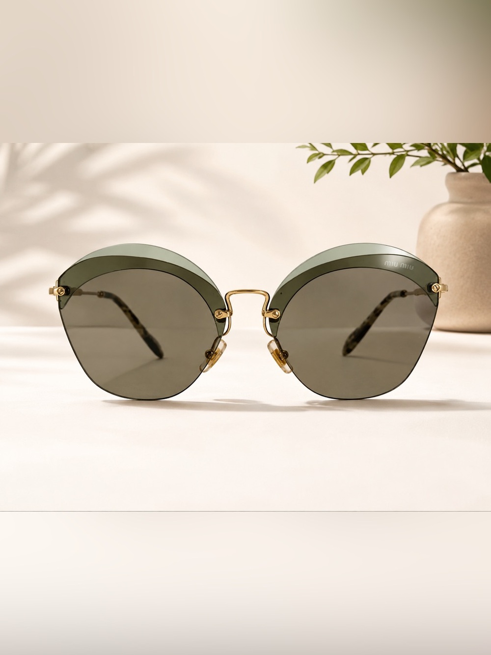Miu Miu Gold Metal Frame Sunglasses with Green Lenses